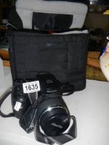 A Finepix camera in Lowepro bag.