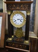 A four pillar French inlaid mantel clock.