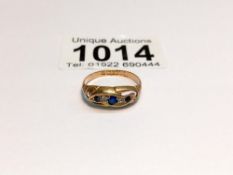 A 9ct gold diamond and sapphire ring, size M, 1.8 grams.