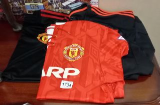 Three official Manchester United shirts, 2 Adidas and one Umbro.