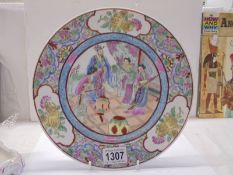 A hand painted Chinese plate, 26 cm diameter.