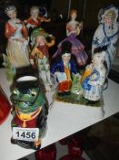 A 19th century Staffordshire figure group, a 'Mr Swamp' jug and other figures.