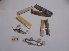 Two silver cased comb, another comb and two charm bracelets.