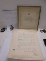 An MBE certificate of Major Joseph Morris Hall signed by Queen Elizabeth II and Prince Phillip