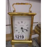 A brass carriage clock marked Bayard.