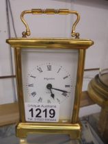 A brass carriage clock marked Bayard.