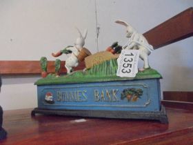A novelty cast iron bunnies money box.
