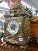 An excellent Victorian brass mounted mantel clock in working order.