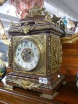 An excellent Victorian brass mounted mantel clock in working order.