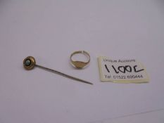 A 9ct gold ring for scrap (1.72g) and a tie pin.