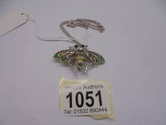 A superb quality white metal bee brooch/pendant with articulated wings on a silver chain (925).
