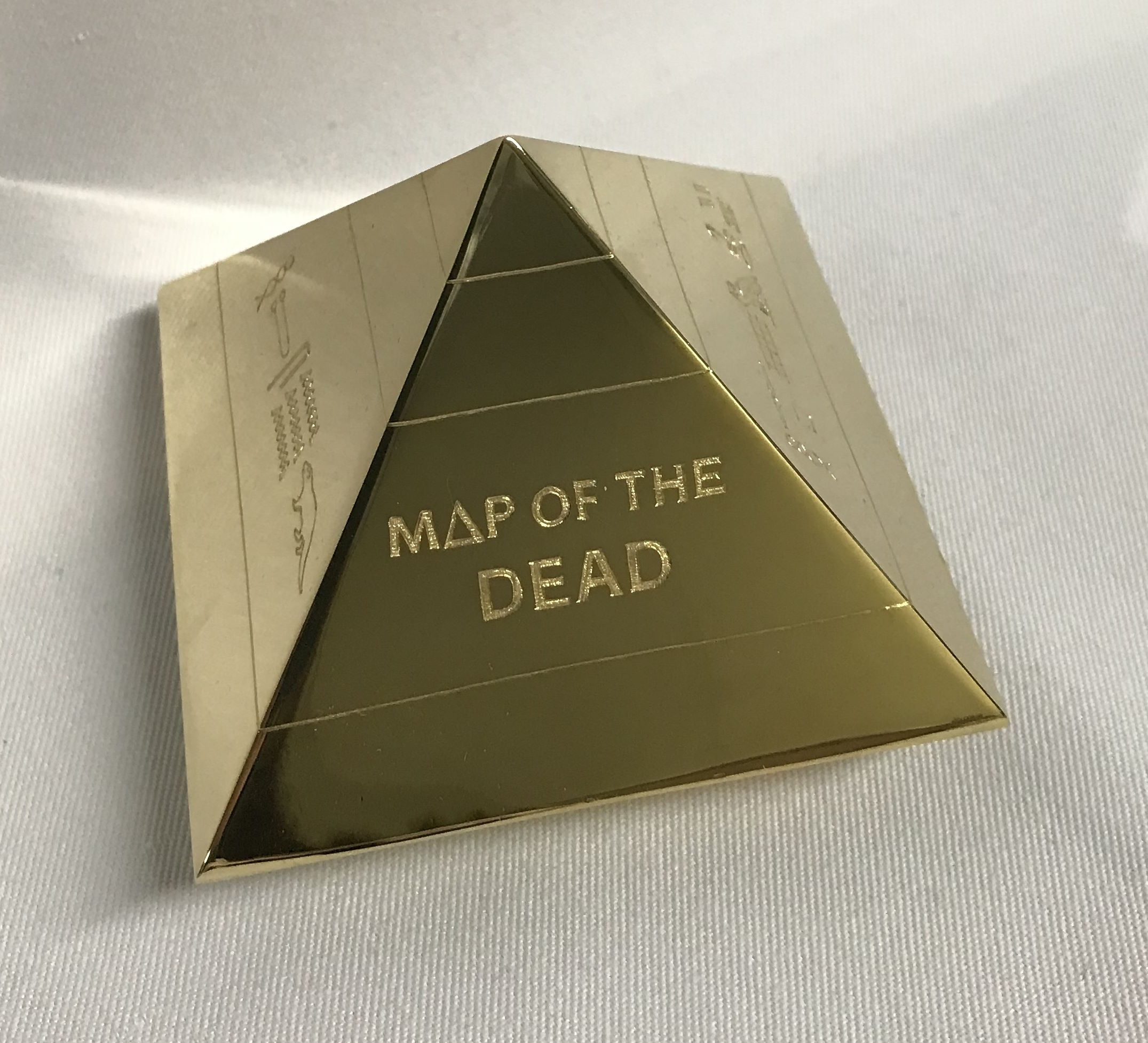 An 18ct gold Pyramid which was awarded as prize for book Map of the Dead by Murray Bailey.