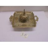 A Persian style brass inkwell.,