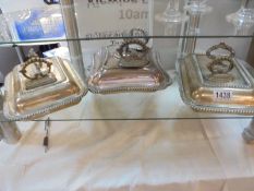 Three silver plate vegetable tureens with spare handles.