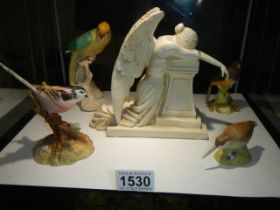 Four porcelain bird figures and an Angel.