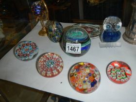 A mixed lot of glass paperweights including millifiori examples.