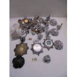 A good lot of police badges, buttons, numbers etc.,