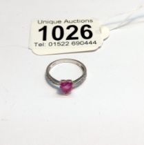 A white gold pink sapphire and diamond ring, size L, 1.8 grams.