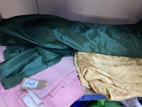 A quantity of fabric including pale pink curtains [faded] Green fabric