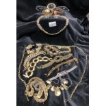 A collection of black & gold costume jewellery