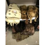 A quantity of fur and fake fur related items, including muff and shoulder cape etc