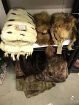 A quantity of fur and fake fur related items, including muff and shoulder cape etc