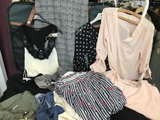 A suitcase of garments in various sizes, colours and styles including Papya, yaya Rose & olive,