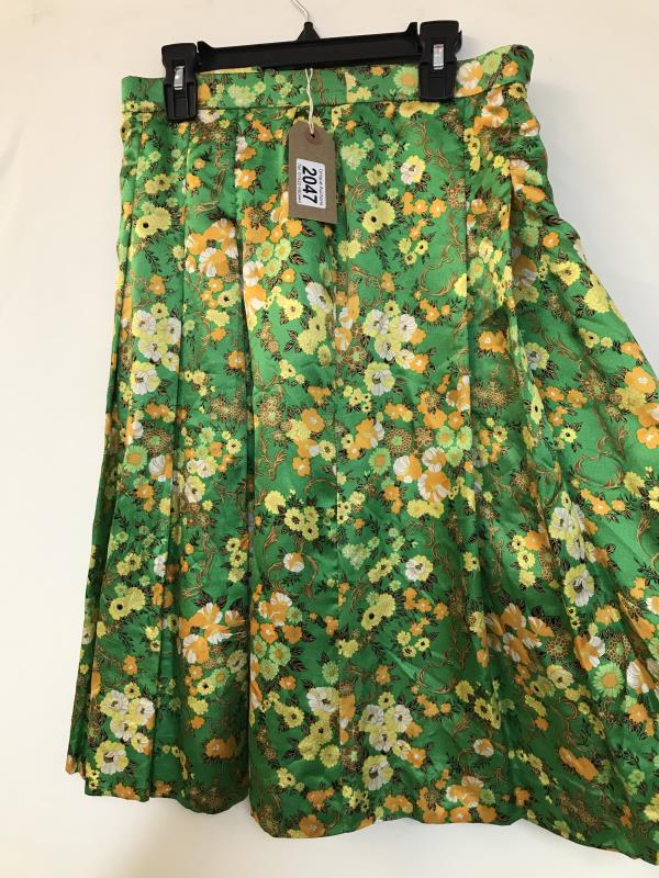 A Vintage 1970's handmade pure silk skirt. Bright green with floral print