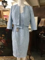 A New Ice Blue two piece by Veni Infantino Italian designer. Silk style fabric with an embossed