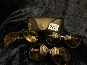 Collection of sunglasses including ray bans case