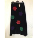 A 1970's Vintage flower power skirt. Black velvet with multicoloured velvet flower applique designer