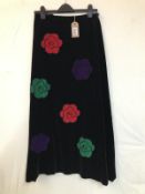 A 1970's Vintage flower power skirt. Black velvet with multicoloured velvet flower applique designer