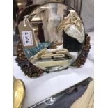 Small round mirror with flower embellishment