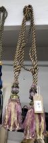 A pair of curtain tie backs in lilac & gold with gems and beading with tassel