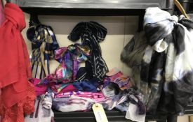A large collection of scarves in various styles, lengths and colours