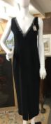 A Black V-necked sequined dress. Front split. Size 10 to 12