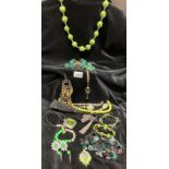 A quantity of Lime, Jade and emerald green costume jewellery