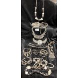 A collection of black and silver costume jewellery