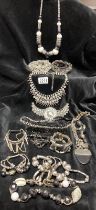 A collection of black and silver costume jewellery