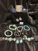 A quantity of turquoise and white metal rings & earrings