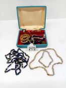 A mixed lot of costume jewellery including necklaces & pendants etc.