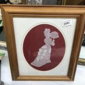 A framed paper embossed Victorian lady