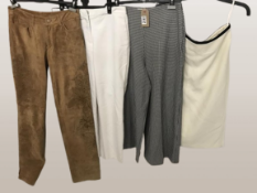 A collection of four pairs of trousers and one skirt. Including Zara
