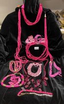 A selection of bright pink costume jewellery, some shell / agate pieces