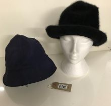 Two cloche hats in shades of blue and black,