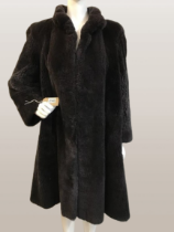 A vintage Fur coat with metal fastening with hand stitching. AF