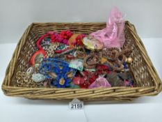 A basket of assorted costume jewellery