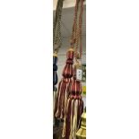 one pair of dark red & gold curtain tie backs with tassels