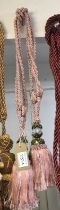 Dark pink curtain tie backs with tassels with decorative gem