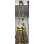 Brown and gold curtain tie backs with tassels
